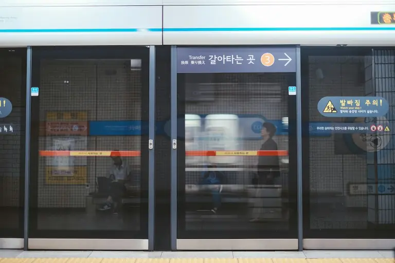 Train platform doors are opening.